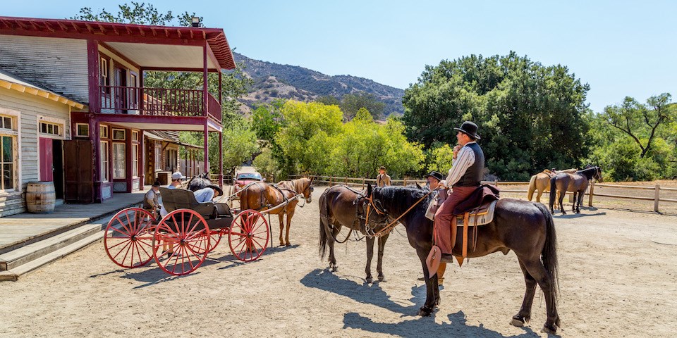 A horseman appears to lead a tour of the shooting set. Paramount Pictures began leasing the ranch in 1927.