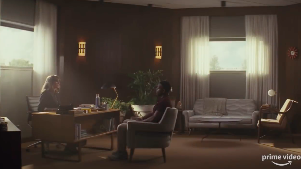 Two people sitting in an office.