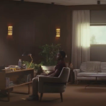 Two people sitting in an office.