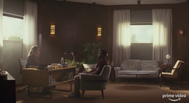 Two people sitting in an office.