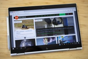 The 2018 HP Elitebook x360 2-in-1 sitting on a wooden table.