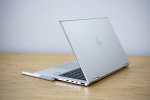 The 2018 HP Elitebook x360 2-in-1 sitting on a wooden table.