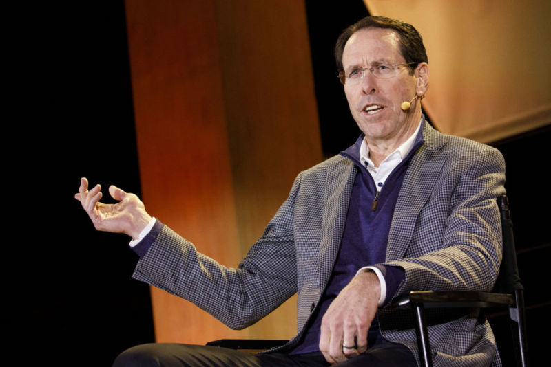 AT&T CEO Randall Stephenson speaking and gesturing with his hand while being interviewed at a tech conference.