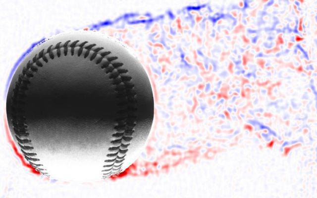 A knuckleball pitch is moving to the left, leaving a wake trailing behind to the right. The blue-colored air is rotating clockwise; the red air is rotating counterclockwise. 