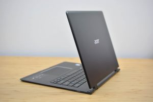The 2018 Acer Swift 7 sitting on a wooden table.