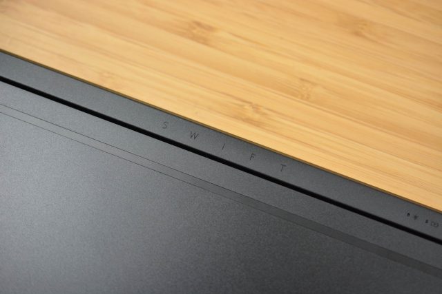 The 2018 Acer Swift 7 sitting on a wooden table.