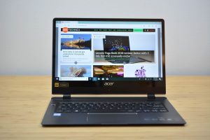 The 2018 Acer Swift 7 sitting on a wooden table.