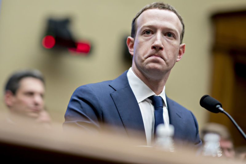 A frowning man in a business suit.