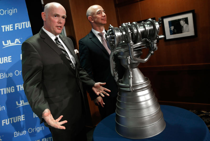 Jeff Bezos (right), founder of Blue Origin and Amazon.com, and Tory Bruno, CEO of United Launch Alliance, showcase the BE-4 rocket engine at a press conference in 2014.