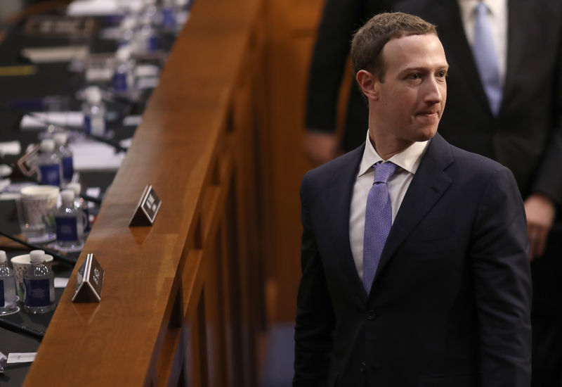 Facebook co-founder, chairman and CEO Mark Zuckerberg departs after testifying before a Senate Joint Committee on Judicial and Commerce hearing in the Hart Senate Office building on Capitol Hill on April 10 2018, in Washington, DC. 