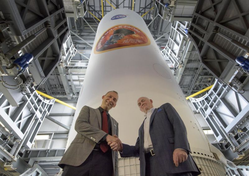 NASA Associate Administrator for Science Thomas Zurbuchen, left, and President and CEO for United Launch Alliance Tory Bruno shake hands after viewing the ULA Delta IV Heavy rocket with NASA's Parker Solar Probe in August.