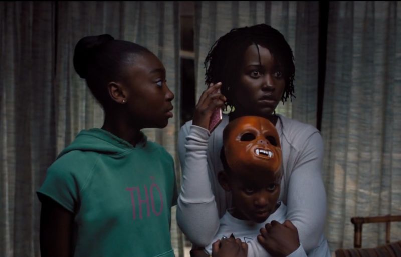Adelaide (Lupita Nyong’o) tells her kids (Shahadi Wright Joseph and Evan Alex) to get their shoes on and be ready to run in <em>Us</em>.”><figcaption class=