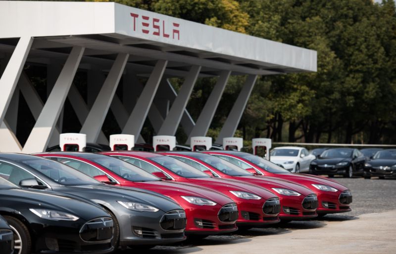 Tesla cars lined up outside of Shanghai dealership.