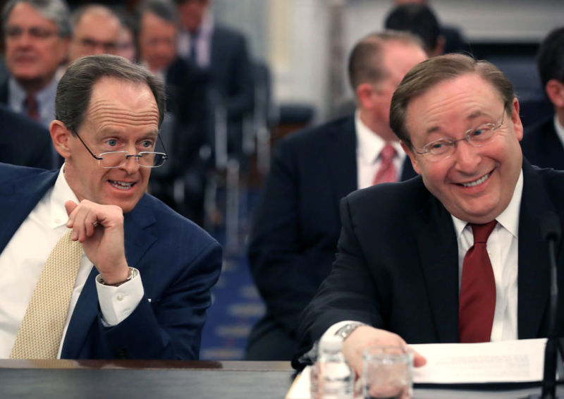 Barry Lee Myers (R) sits with Sen. Pat Toomey (R-PA) (L), during his Senate Commerce, Science and Transportation Committee confirmation hearing to lead NOAA in 2017.