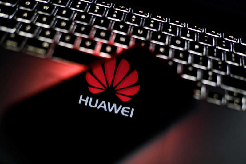 Illustration including a Huawei logo, a smartphone, and keyboard.
