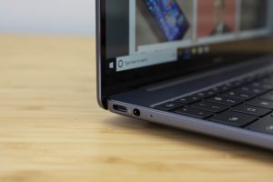 Huawei's Matebook 13 ultrabook sitting on a wooden table.