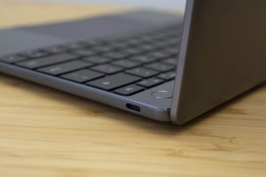 Huawei's Matebook 13 ultrabook sitting on a wooden table.