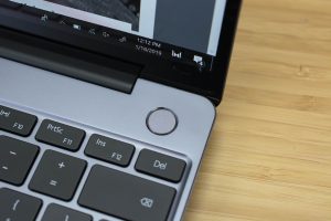 Huawei's Matebook 13 ultrabook sitting on a wooden table.