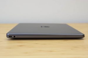 Huawei's Matebook 13 ultrabook sitting on a wooden table.
