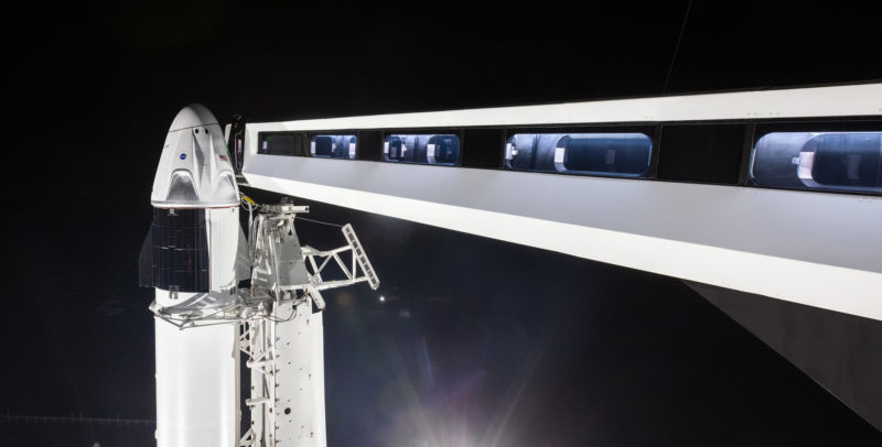 A rocket prepares for a nighttime launch.