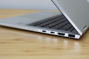 The HP Elitebook x360 1040 G5 sitting on a wooden table.