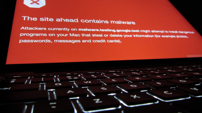 A laptop monitor warns of an impending encounter with malware.
