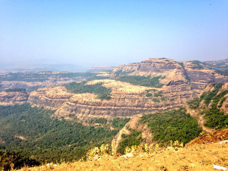 These huge layered volcanic deposits formed during many large eruptions or some huge ones?