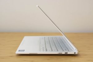 The Dell XPS 13 laptop sitting on a wooden table.