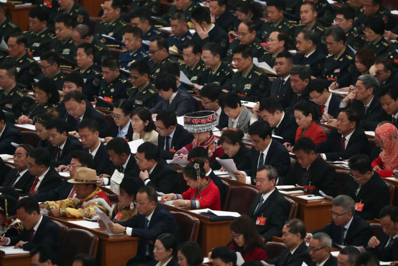 Deputies of the 13th National People's Congress listen to Chinese Premier Li Keqiang's speech during the opening of the Two Sessions at The Great Hall of People on March 5, 2019 in Beijing, China. 