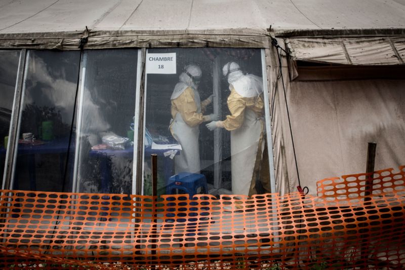 Health workers are seen inside the 'red zone' of an Ebola treatment centre, which was attacked in the early hours of the morning on March 9, 2019 in Butembo. 