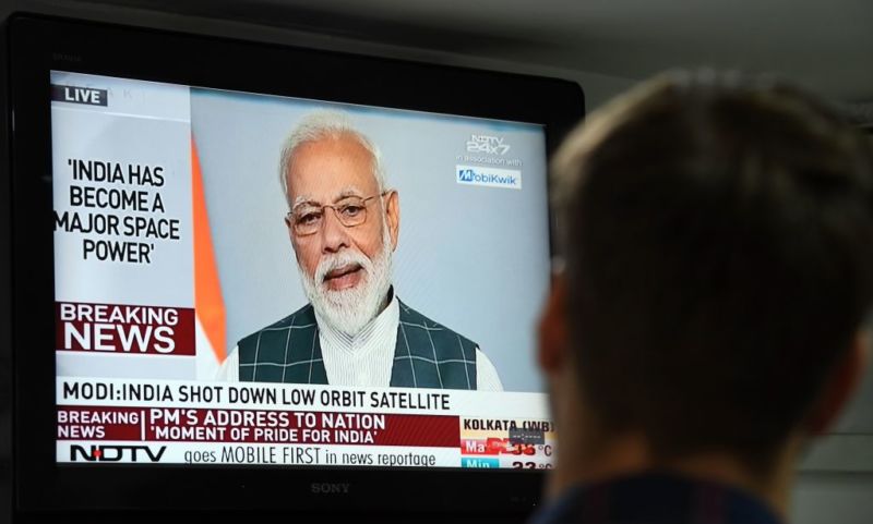 Indian Prime Minister Narendra Modi's addresses the nation on a local news channel in New Delhi on March 27.