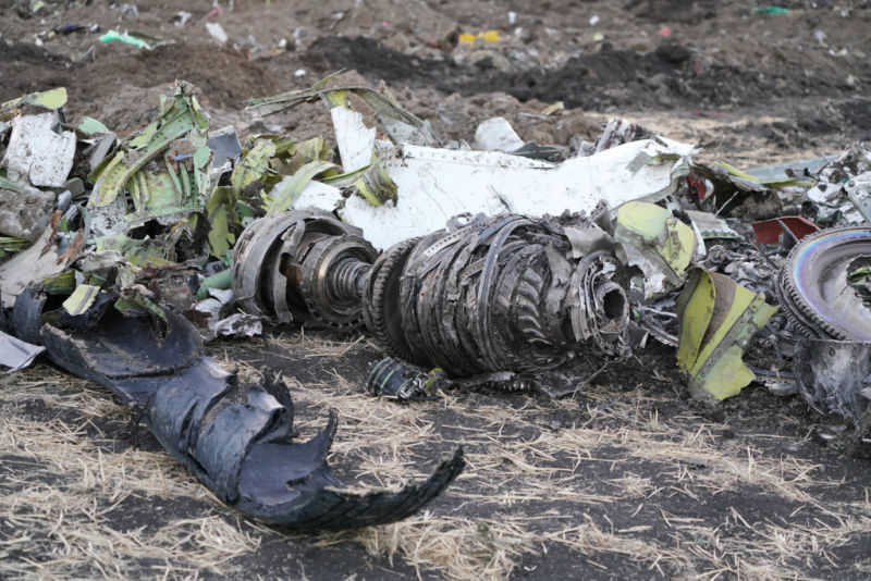 BISHOFTU, ETHIOPIA - MARCH 11:  Parts of an engine and landing gear lie in a pile after being gathered by workers during the continuing recovery efforts at the crash site of Ethiopian Airlines flight ET302.