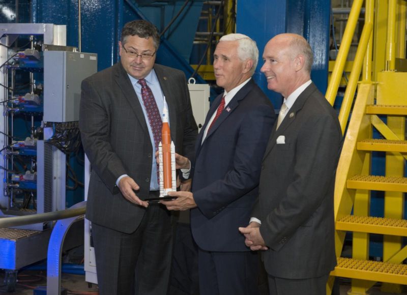 Todd May (left), then director of the Marshall Space Flight Center, introduces Vice President Mike Pence (center) to a space launch system model. Congressman Robert Aderholt (R-Ala.) Stands to the right.