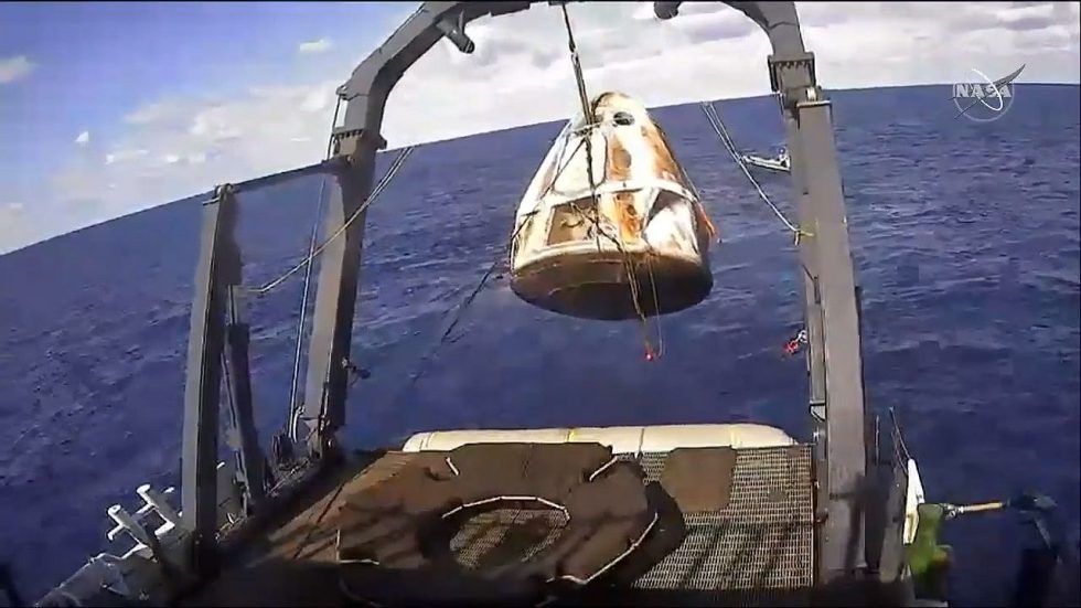 The Go Searcher recovery vessel brings Dragon on board.