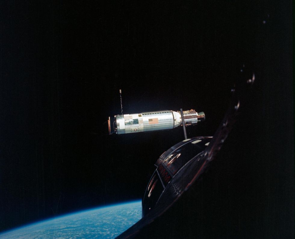 The Agena Target Docking Vehicle is photographed from the Gemini-10 spacecraft during rendezvous in space. They are 41 feet (about 12.5 meters) apart.