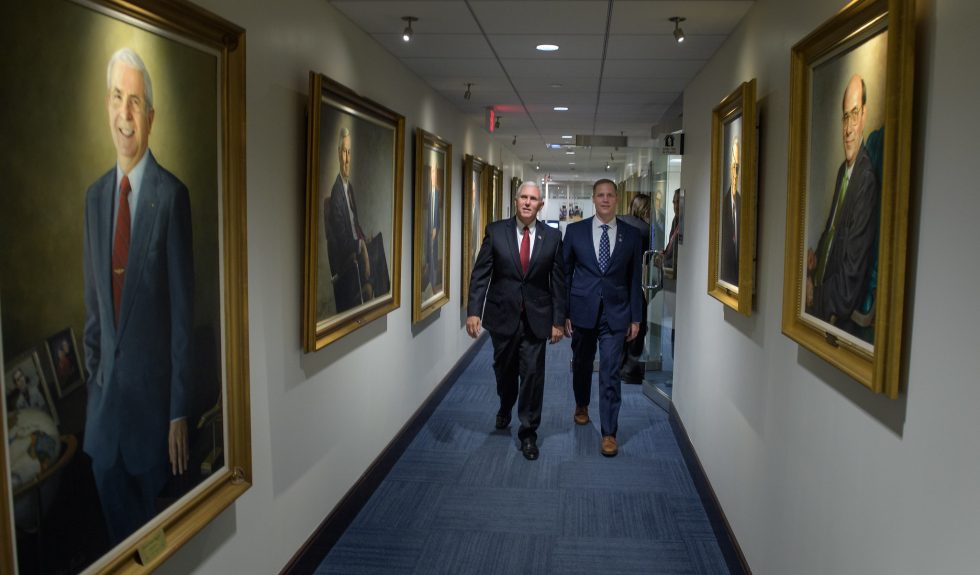 Vice President Mike Pence, left, and NASA Administrator Jim Bridenstine walk through NASA Headquarters in 2018.