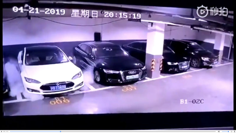 Smoke billows out from under a Tesla Model S shortly before it erupted into flames in a parking garage in Shanghai, China, on April 21st.