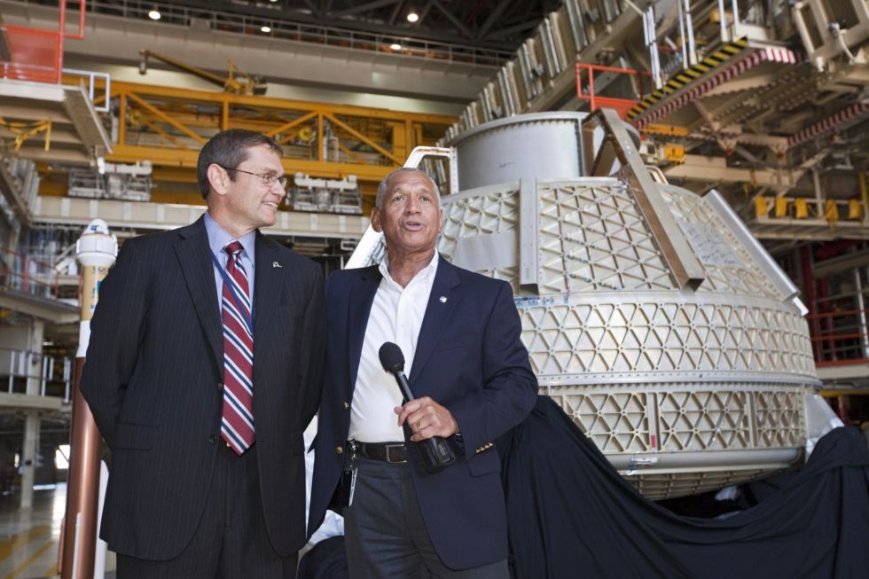 NASA Administrator Charlie Bolden, right, and Boeing space chief John Elbon in front of a Starliner in 2012.