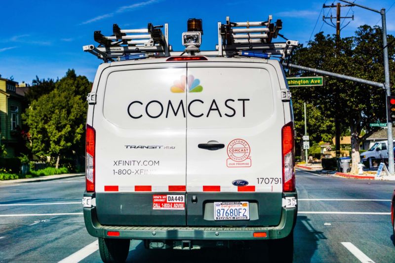 The back of a Comcast pickup truck traveling down a street in Sunnyvale, California.