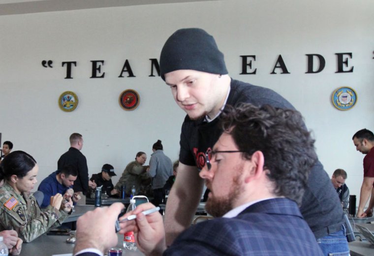 Participants in AvengerCon III, held at the McGill Training Center at Fort Meade, Maryland, on November 27 take part in a lock pick village put on by TOOOL (The Open Organisation of Lockpickers).