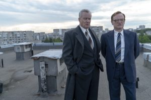 Shcherbina and Legasov standing on a roof.