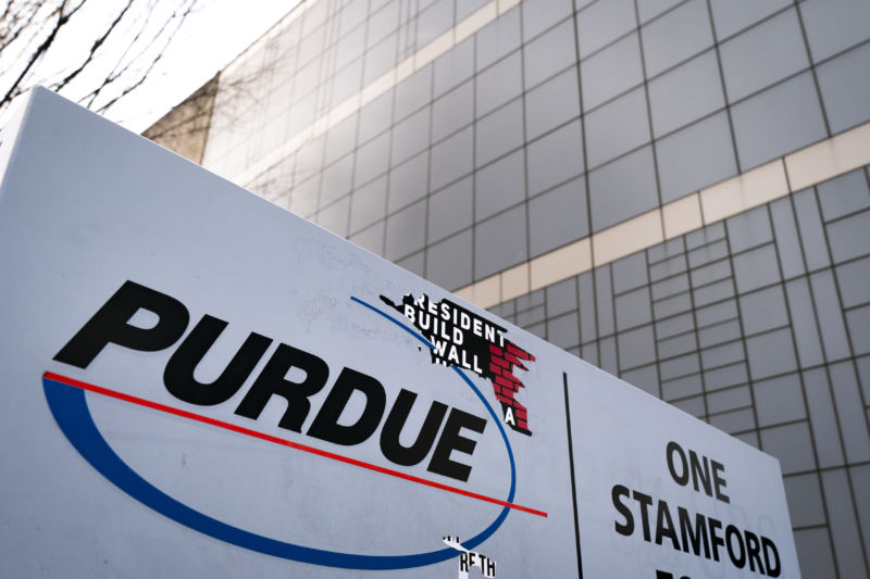  Purdue sign outside a large glass building 
