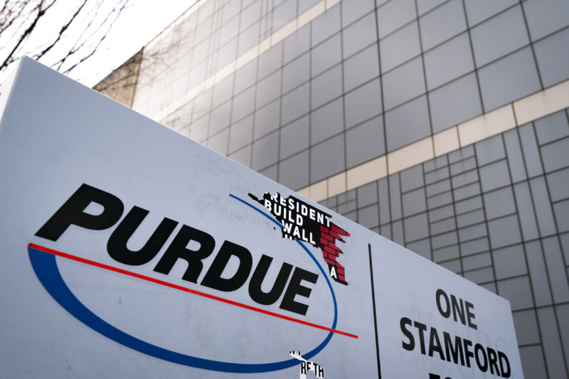 Purdue sign outside a large glass building.