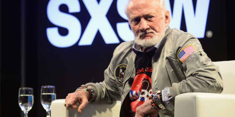 Buzz Aldrin is looking forward, not 