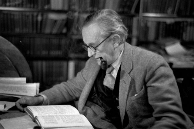 J.R.R. Tolkien reading in his study at Merton College, Oxford, in December 1955. 