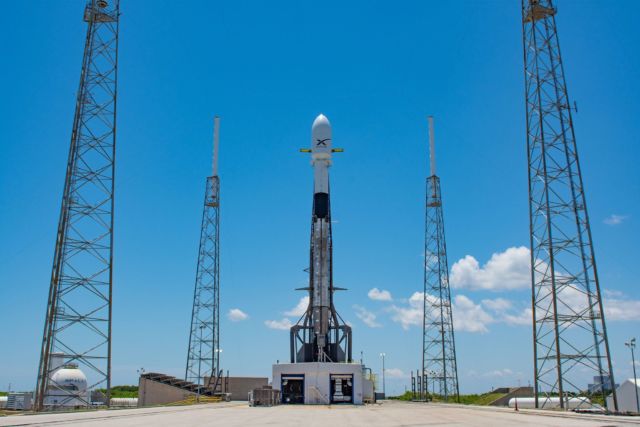The begrimed Falcon 9 booster, back at the launch pad with its Starlink satellite payload in May 2019.