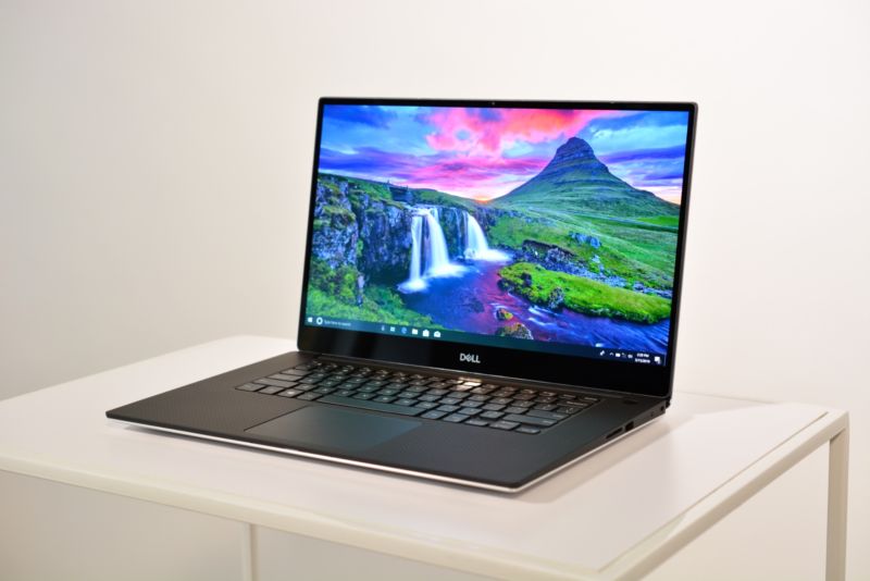 The new XPS 15 laptop with OLED display on a white table.