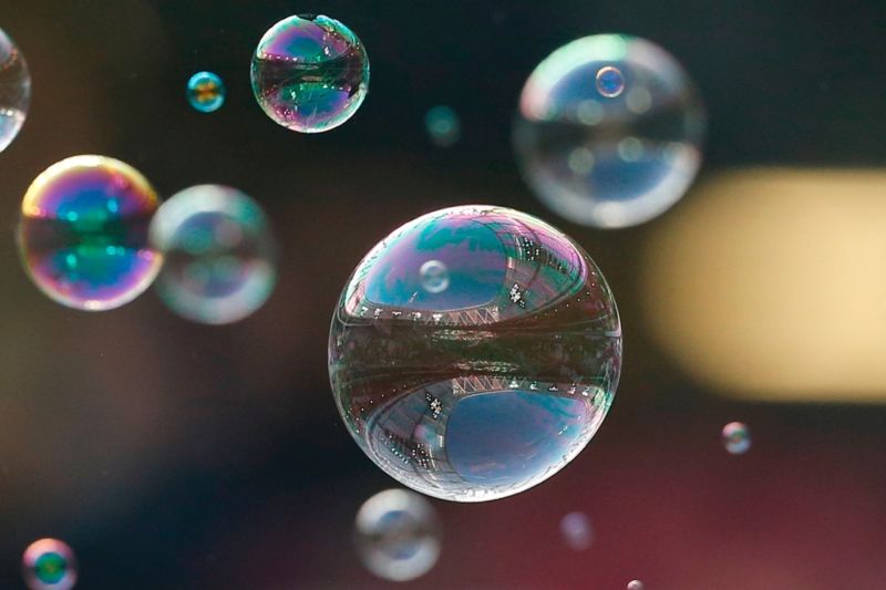 Closeup photograph of bubbles floating through the air.