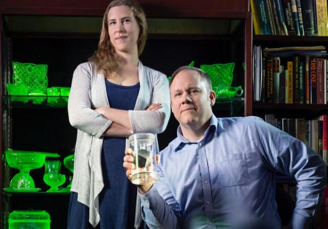 UMD graduate student Miriam Hiebert and physicist Timothy Koeth with the uranium cube that started it all.