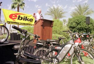Lee Iacocca stands at the podium to announce his new E-Bike that has been named the official bike of the Palm Springs Desert Resorts October 5, 2000 in Palm Desert, CA